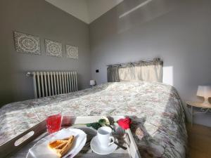 Postel nebo postele na pokoji v ubytování Palazzetto del Pittore
