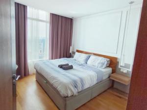 Voodi või voodid majutusasutuse Vortex Suites Free Wi-Fi KL Tower View 中文房东 toas