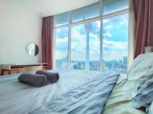 Voodi või voodid majutusasutuse Vortex Suites Free Wi-Fi KL Tower View 中文房东 toas