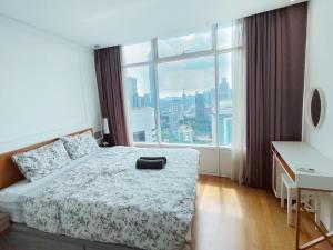 Voodi või voodid majutusasutuse Vortex Suites Free Wi-Fi KL Tower View 中文房东 toas