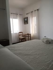 Tempat tidur dalam kamar di Hotel y Plaza JMI