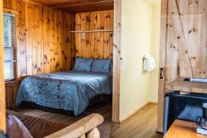 Postel nebo postele na pokoji v ubytování The Long View Lodge