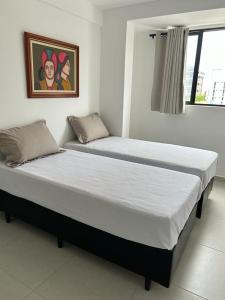 Кровать или кровати в номере Apartamento Intermares