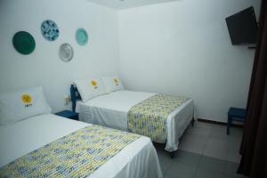 Voodi või voodid majutusasutuse HOTEL INTI toas