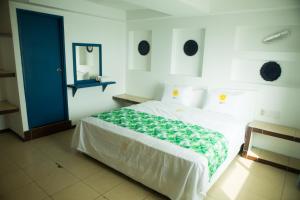 Voodi või voodid majutusasutuse HOTEL INTI toas