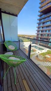a balcony with a table and a chair on a deck at Premium Apartment, Family friendly in Vienna