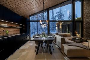 a living room with a couch and a table at Villa Laponia in Äkäslompolo