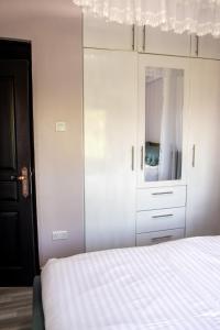 Postel nebo postele na pokoji v ubytování Gracieus Residences