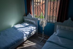 Postel nebo postele na pokoji v ubytování Gracieus Residences