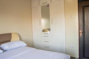 Postel nebo postele na pokoji v ubytování Gracieus Residences