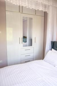 Postel nebo postele na pokoji v ubytování Gracieus Residences