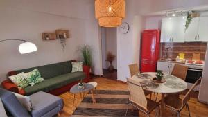 a living room with a couch and a table at Charming Vólos House 2 in Volos
