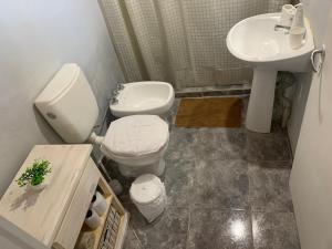 a bathroom with a toilet and a sink at Departamento amoblado 1 Dtorio in Corrientes
