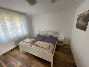 Postel nebo postele na pokoji v ubytování Ferienwohnung bei Bad Ems im Lahntal