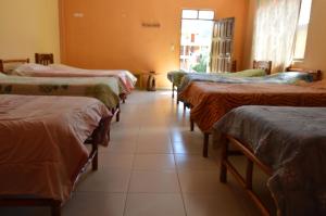 Postel nebo postele na pokoji v ubytování Hostal Coronel Pedro Arraya