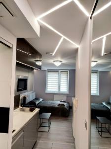 Katil atau katil-katil dalam bilik di Apartament Źródełko