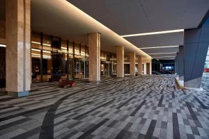 an empty hallway of a building with columns and lights at Marriott Marquis Houston in Houston
