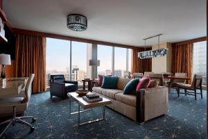 a living room with a couch and a table at Marriott Marquis Houston in Houston