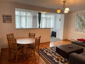 a living room with a table and a couch at Apartment Victoria in Victoria