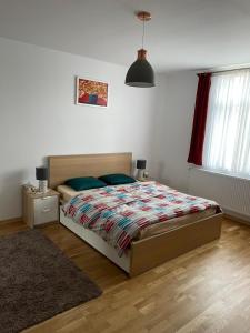 a bedroom with a large bed and a rug at Apartment Victoria in Victoria