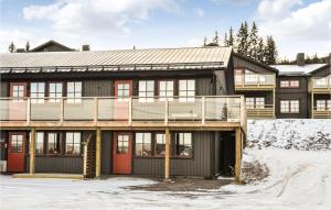 a large building with snow on the ground at Stunning Apartment In Slen With Kitchen in Sälen