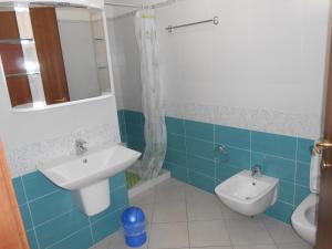a bathroom with a sink and a toilet at Appartamenti Elisa in Assisi
