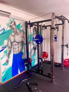 a gym with a painting on the wall at Alpes Lima Kennedy Hostel in Lima