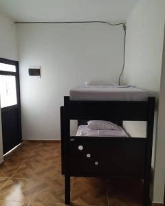 Postel nebo postele na pokoji v ubytování Cabaña 41, aldea Doradal Santorini Colombiano