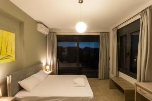 Posteľ alebo postele v izbe v ubytovaní Saronic TopView Villa