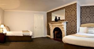 A bed or beds in a room at Clifden House by Nina