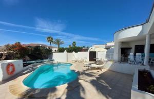 a swimming pool on the patio of a house at Sol y Luna Room & Suite Lanzarote Holidays - Heated pool! in Playa Blanca