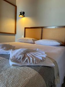 Ένα ή περισσότερα κρεβάτια σε δωμάτιο στο Lyttos Bungalows