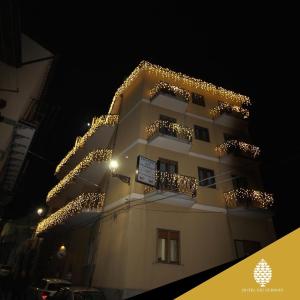 a building with christmas lights on it at night at Hotel dei Nebrodi in Cesarò