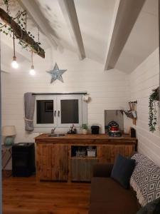 a living room with a table and a star on the wall at Seafield Cabin in Tromra