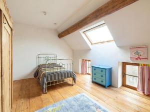 a bedroom with a bed and a window at Magnificent square farm in the beautiful blossom region in Sint-Truiden