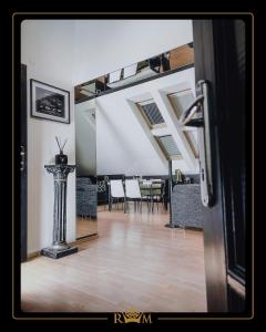 a living room with a table and chairs and a mirror at RM Luxury Apartment in Prague • 6 People • Free Parking • Pets in Prague