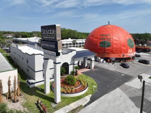 an aerial view of a hotel with a large red dome at Stayable Kissimmee West in Kissimmee