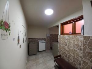 a bathroom with a sink and a toilet in a room at Mini depa en centro histórico de Pueblo Libre in Lima