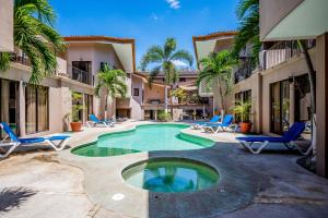 a courtyard with a swimming pool in a house at The Cove #15 in Ocotal