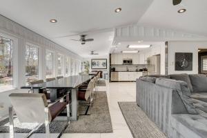 a living room with a table and a couch at Resort-Style Paradise w 2 Pools in Las Vegas