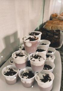 a bunch of cupcakes sitting on top of a table at Hotel Girassol in Imbé