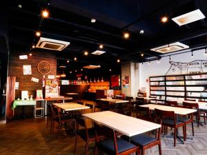 a restaurant with tables and chairs in a room at Hotel Abest Osu Kannon Ekimae Hane no Yu in Nagoya