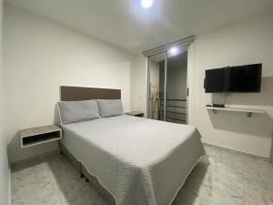 Postelja oz. postelje v sobi nastanitve Apartamento amoblado al norte de Armenia