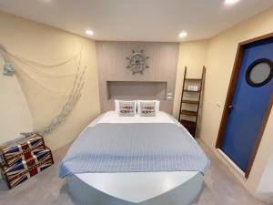 Postel nebo postele na pokoji v ubytování 日月潭五船民宿 5Boat B&B