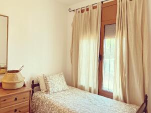 Postel nebo postele na pokoji v ubytování Villa Mas Blau Munt