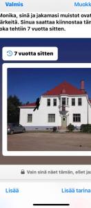 een website screenshot van een wit huis met een foto bij Vanha Kanttorila in Lovisa