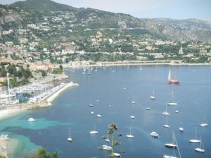 a view of a harbor with boats in the water at Hôtel La Flore in Villefranche-sur-Mer