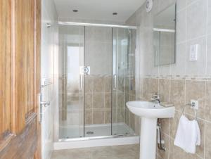 a bathroom with a shower and a sink at Cottage in Pwllheli +20 photos