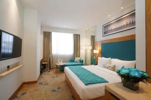 Best Western Plus Chandigarh Mohali客房内的一张或多张床位
