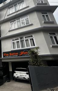 a car parked in the garage of a building at The Better Inn in Gangtok